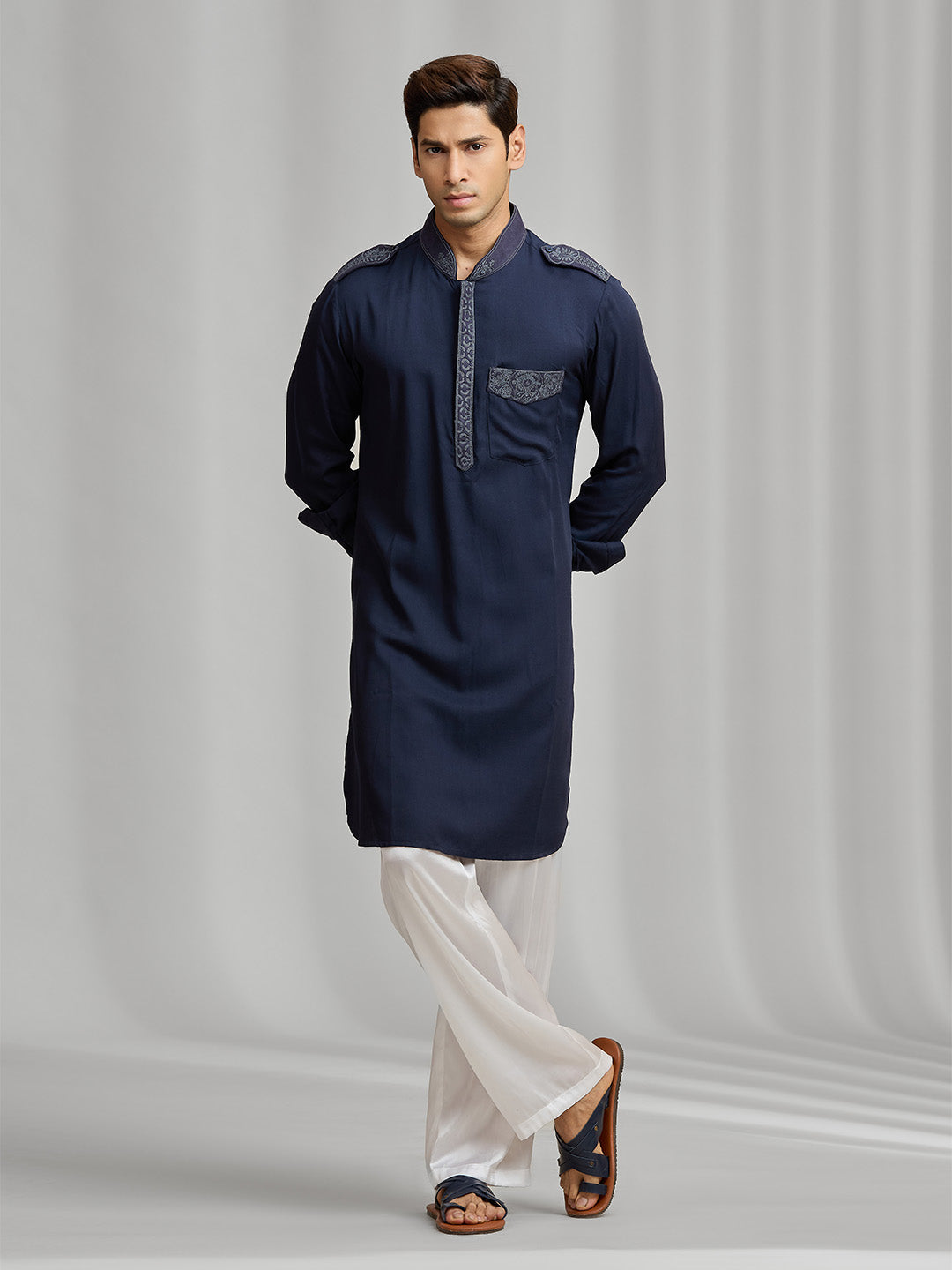 Navy blue silk kurta set with tonal embroidery, paired with white bottoms. - KORANM