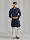 Navy blue silk kurta set with tonal embroidery, paired with white bottoms. - KORANM