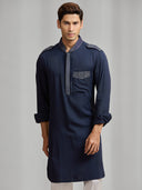 Navy blue silk kurta set with tonal embroidery, paired with white bottoms. - KORANM
