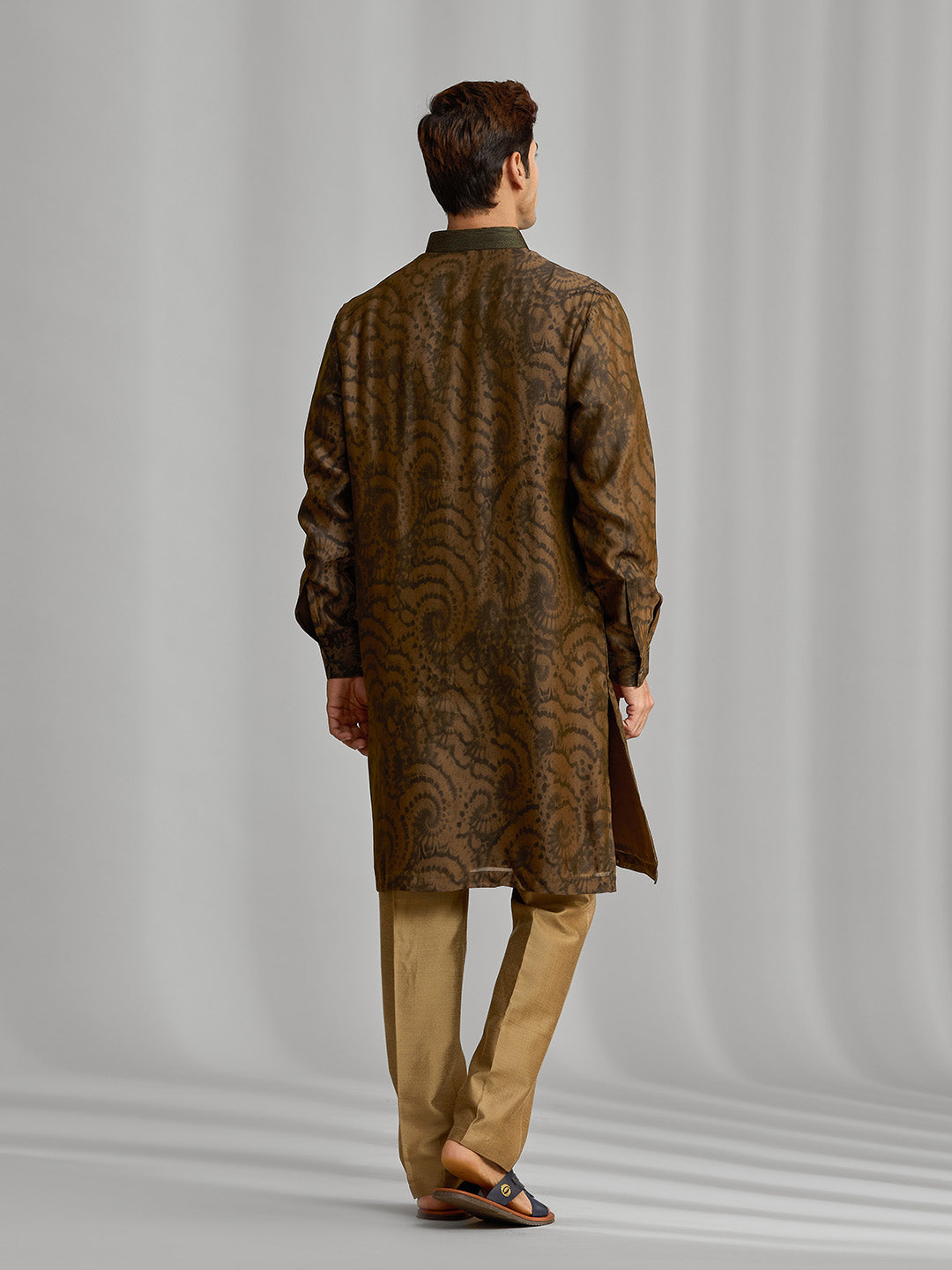 Olive silk-blend kurta with rhythmic print, paired with antique gold Aligarhi pants. - KORANM