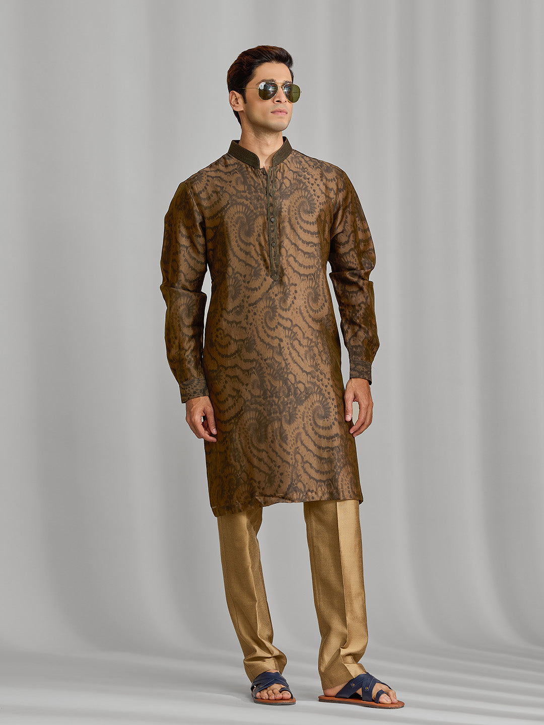 Olive silk-blend kurta with rhythmic print, paired with antique gold Aligarhi pants. - KORANM