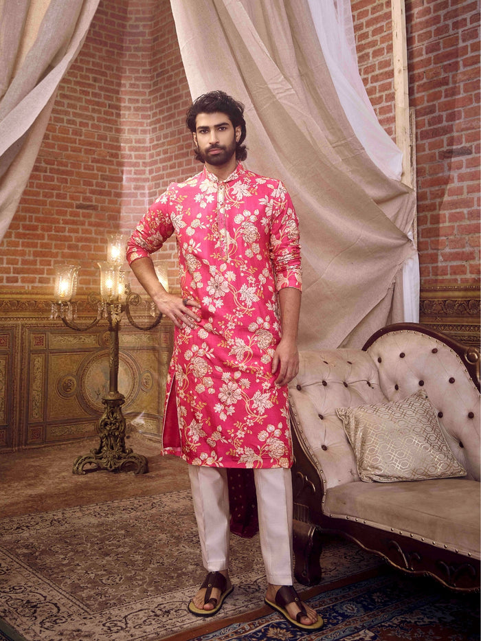 Men’s pink floral kurta set paired with natural Aligarhi trousers