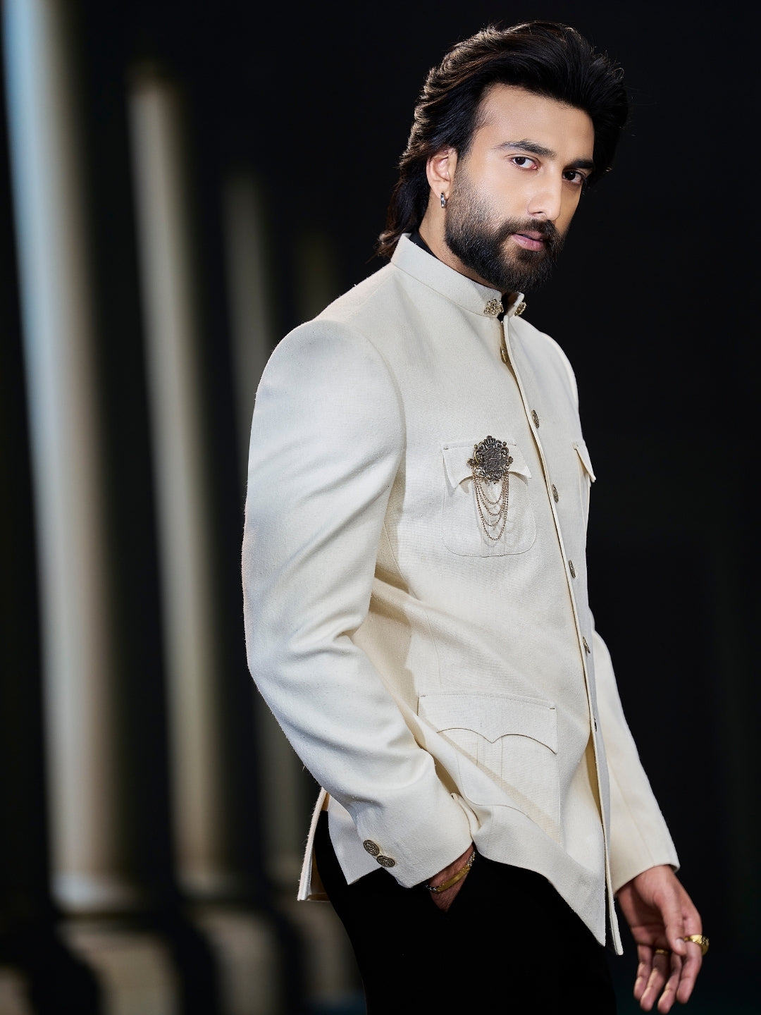 Close-up of textured Matka silk Bandhgala coat with brooch – Kora by Nilesh Mitesh
