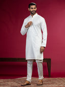 Cream Kurta with sequence work and Aligadi pants.