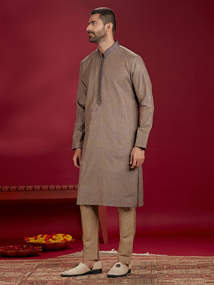 Olive Jacquard Rubelli Kurta Paired with an Olive Chudidar.
