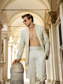 Close-up of embroidery and textured detailing on linen satin fabric