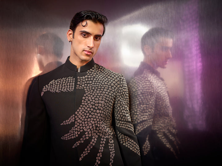 Black textured silk Jodhpuri suit with embroidery and coordinated pants.