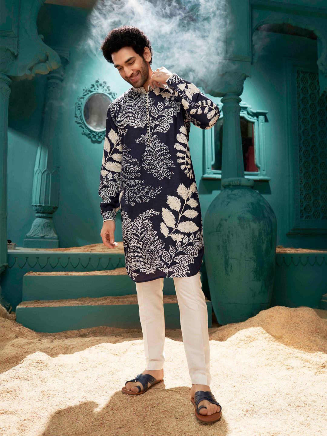 A navy blue kurta with cream color aligadi