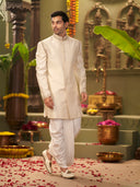 Muhurtham set with cream Raw Silk hand highlight work on Sherwani, and Dhoti
