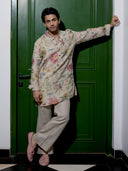 Man wearing natural floral print kurta with matching Aligarhi pants and mandarin collar