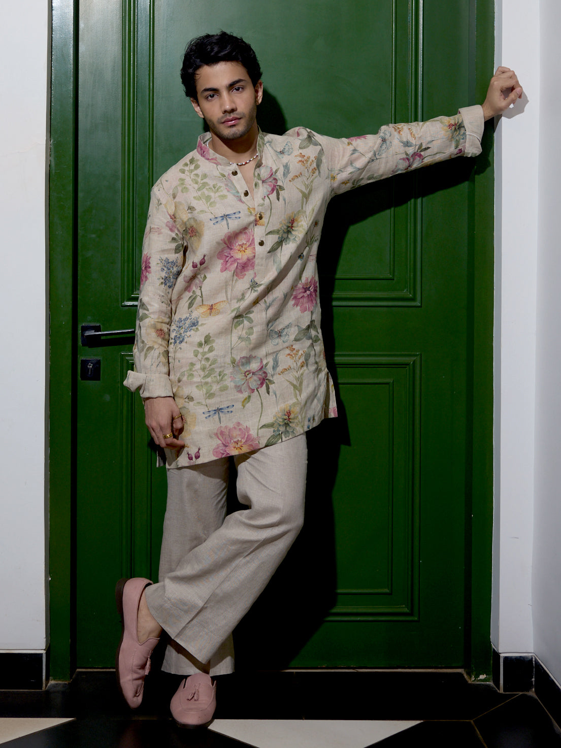 Man wearing natural floral print kurta with matching Aligarhi pants and mandarin collar