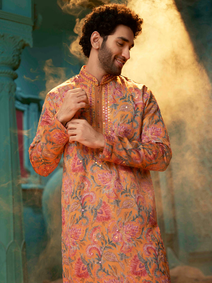 Orange kurta made with blended silk with a natural Chudidar pant.