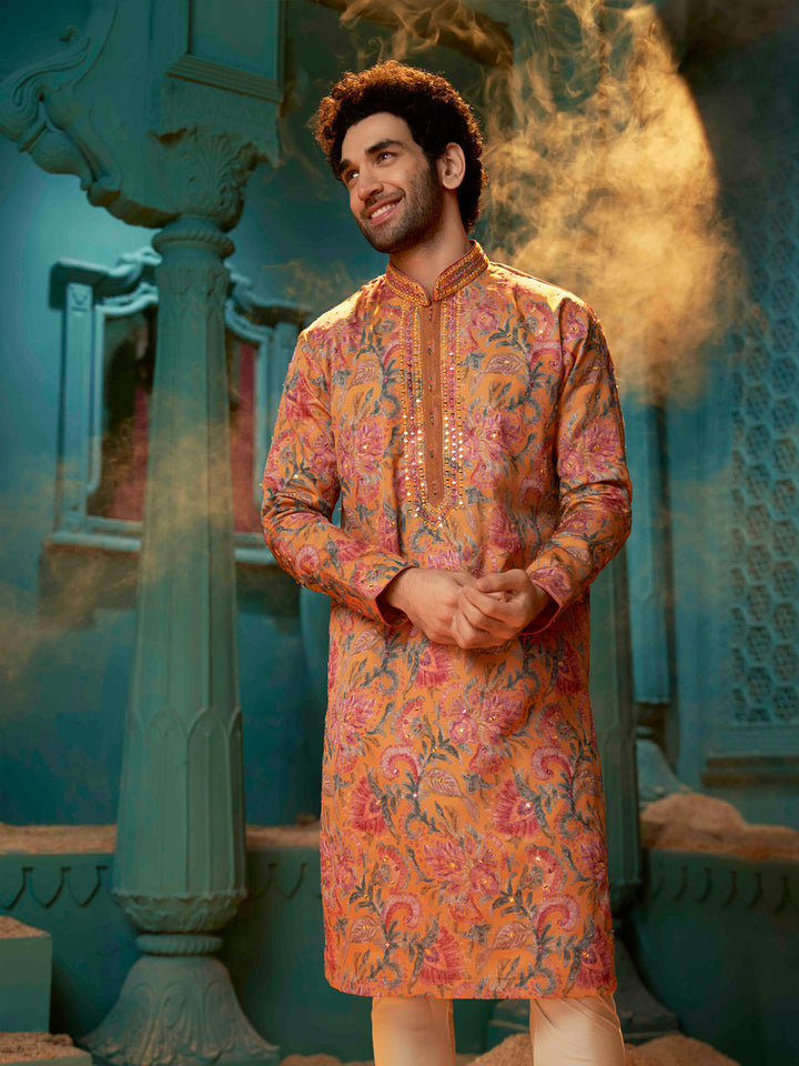 Orange kurta made with blended silk with a natural Chudidar pant.