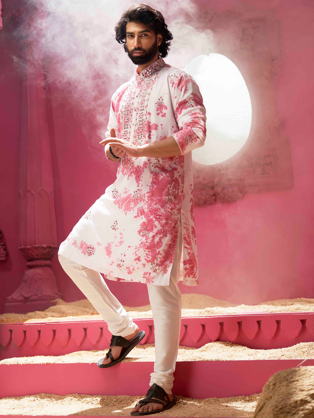 Ivory pink with mirrors and a cream colour churidar.