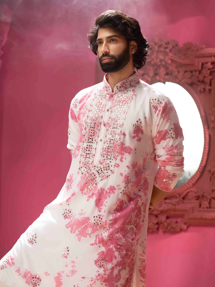 Ivory pink with mirrors and a cream colour churidar.