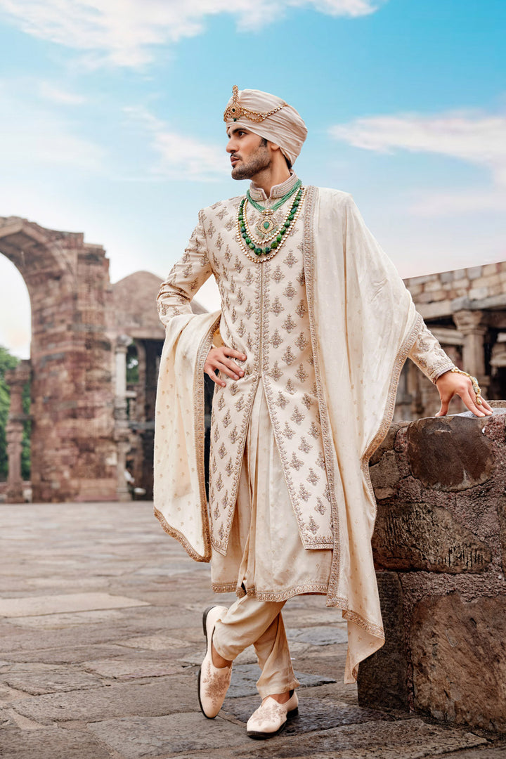 Beige Embroidered Sherwani with Anarkali Silk Kurta and Beige Churidaar for Groom.