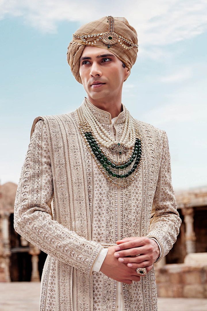 Cream Silk Sherwani, Embroidered Anarkali Kurta, and Churidaar.