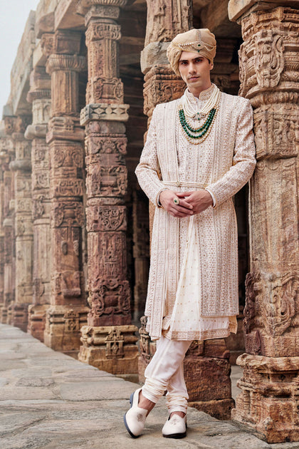 Cream Silk Sherwani, Embroidered Anarkali Kurta, and Churidar.