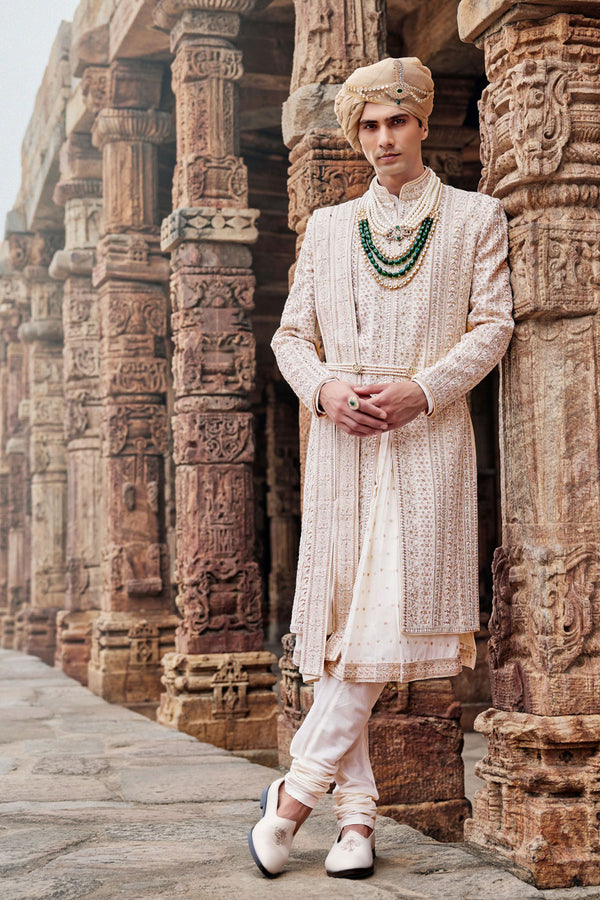 Cream Silk Sherwani, Embroidered Anarkali Kurta, and Churidaar.