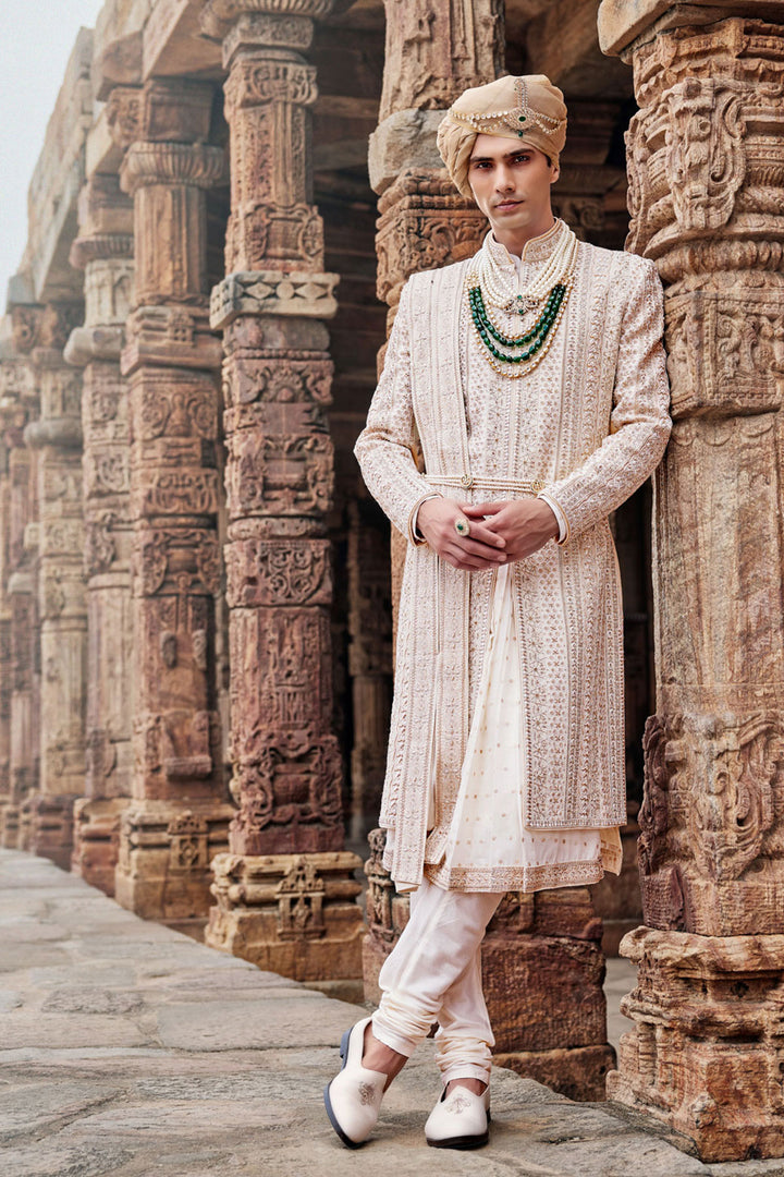 Cream Silk Sherwani, Embroidered Anarkali Kurta, and Churidaar.