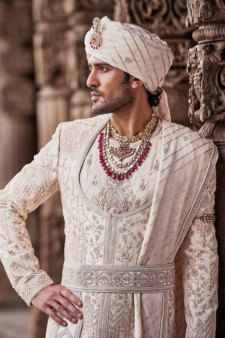 Cream Embroidered Sherwani with Anarkali Silk Kurta and Cream Churidaar.