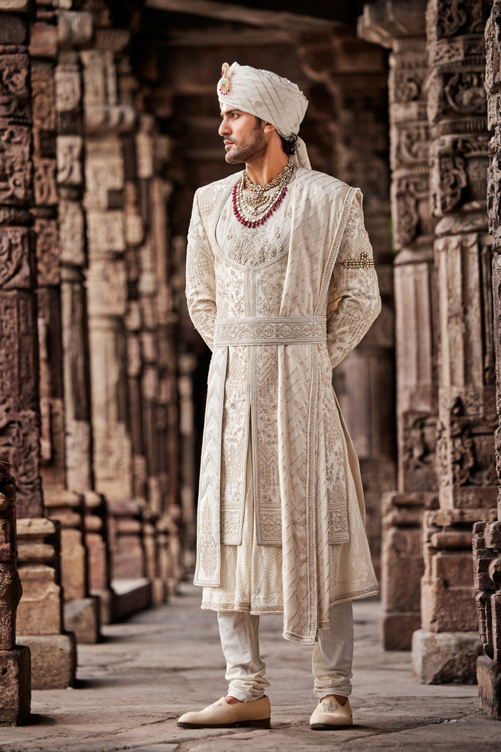 Cream Embroidered Sherwani with Anarkali Silk Kurta and Cream Churidaar.