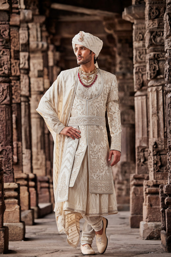 Cream Embroidered Sherwani with Anarkali Silk Kurta and Cream Churidaar.