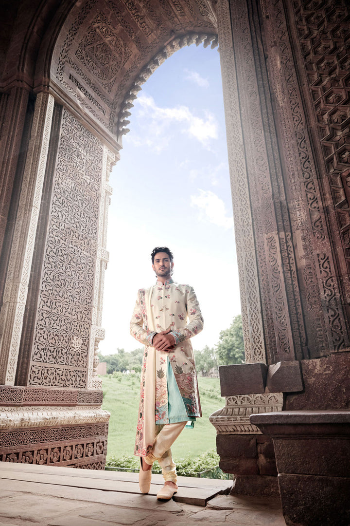 Cream Tesla Fabric Sherwani with Matching Kurta, Dupatta, and Churidaar.