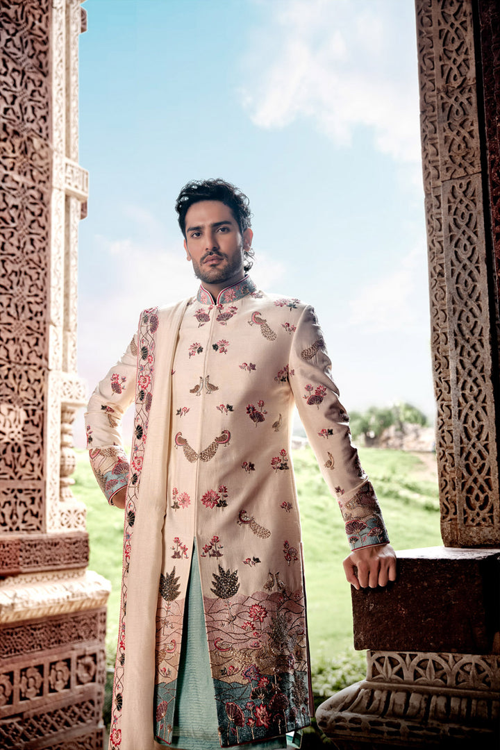 Cream Tesla Fabric Sherwani with Matching Kurta, Dupatta, and Churidaar.