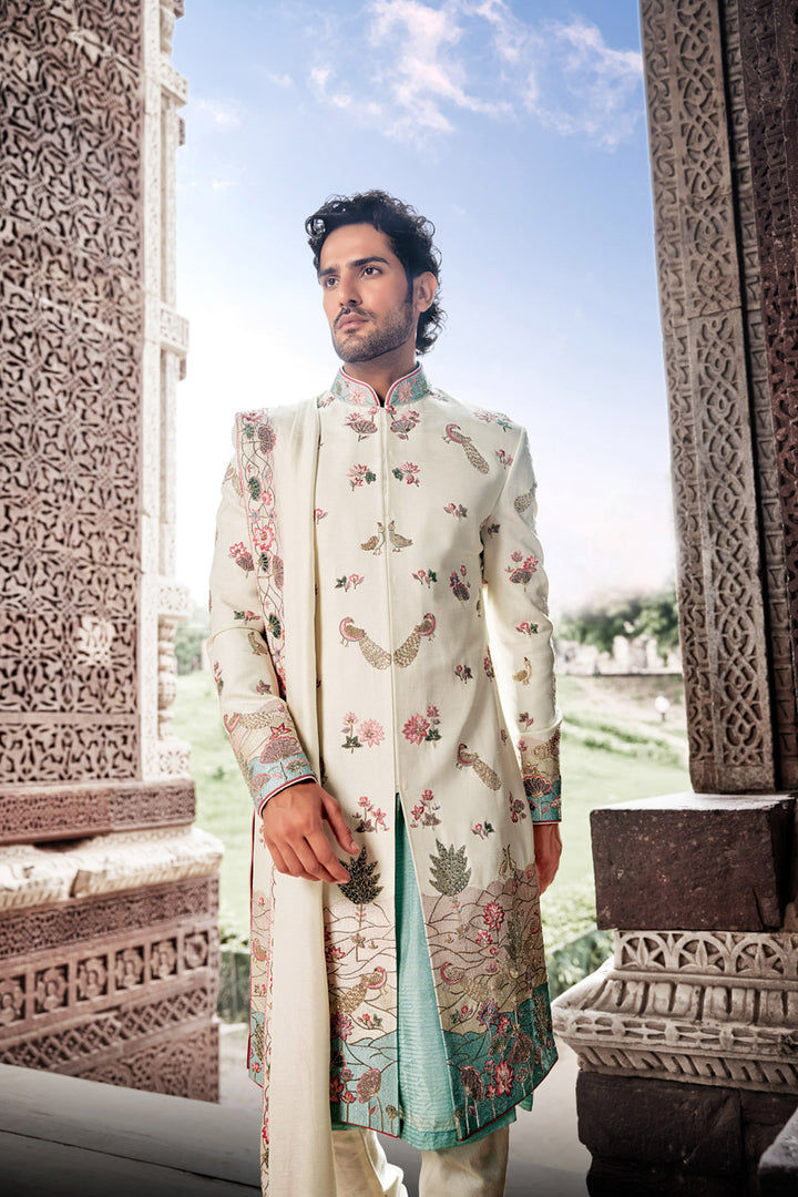 Cream Tesla Fabric Sherwani with Matching Kurta, Dupatta, and Churidaar.