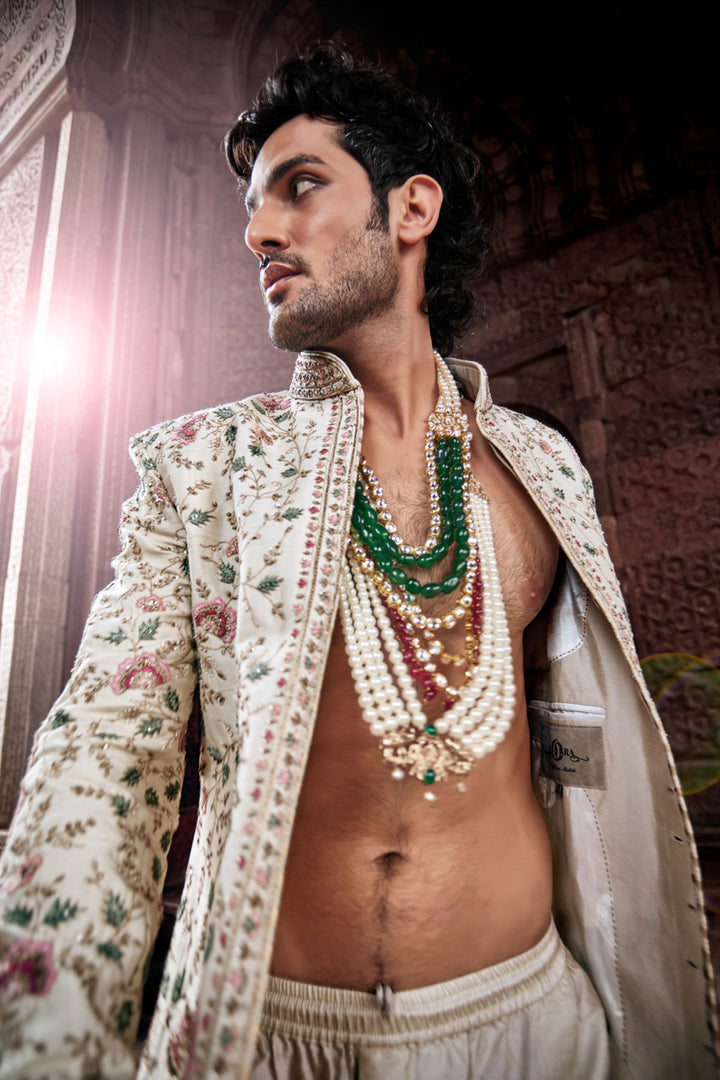 Beige Sherwani with Tesla Fabric, Embroidered Kurta and Churidaar.