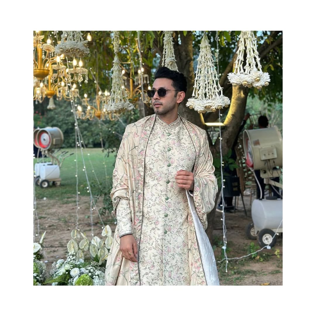 Sahil Anand radiates royal charm in our cream raw silk embroidered sherwani with dupatta and churidar