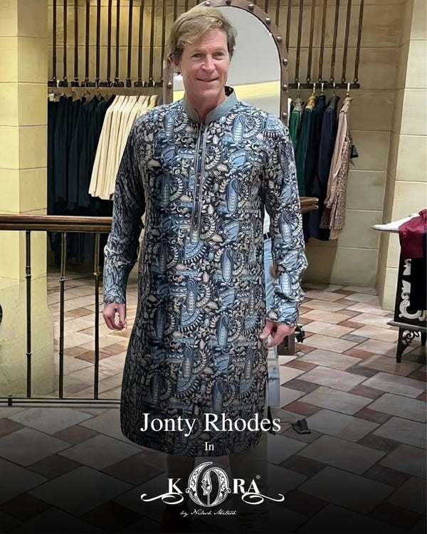 Cricketer Jonty Rhodes brings effortless charm in our teal blue muslin digital silk kurta with embroidery and print.