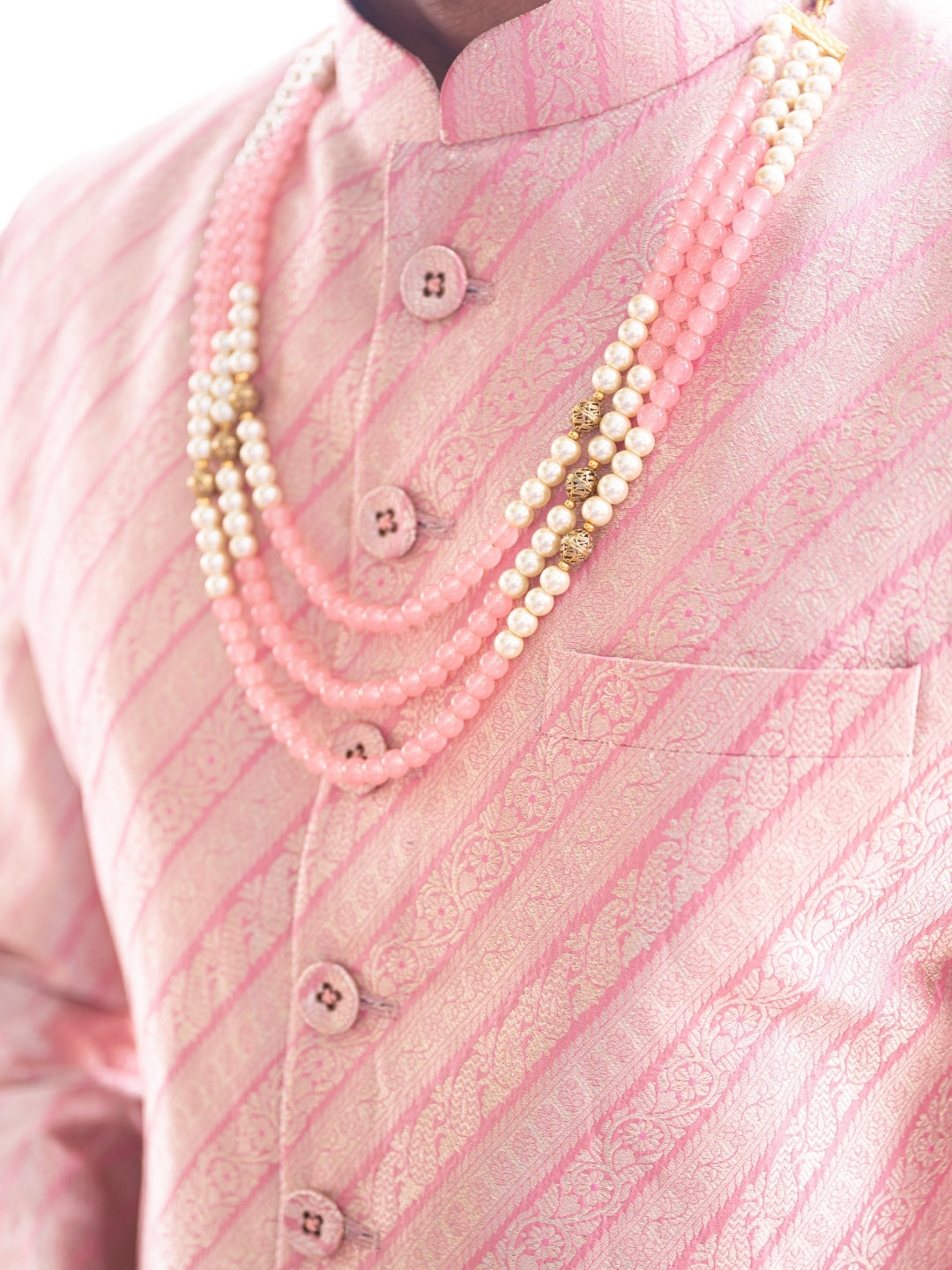 Close-up of Hil silk fabric texture on pink sherwani for men