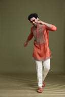 Close-up of dori embroidery on rust satin linen kurta for men