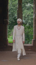 Cream Embroidered Sherwani with Anarkali Silk Kurta and Cream Churidaar.