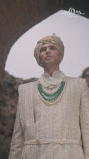 Cream Silk Sherwani, Embroidered Anarkali Kurta, and Churidar.